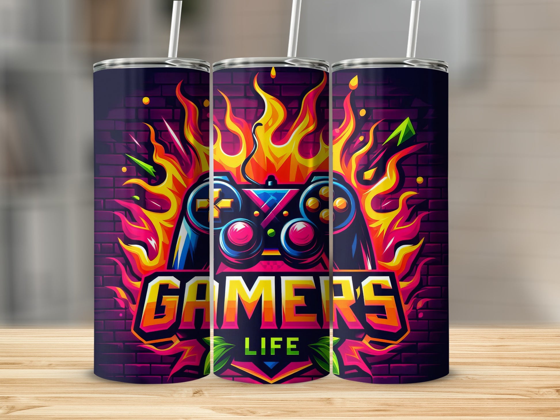 Gamer life logo with controller, flames, and brick background on three tumblers.