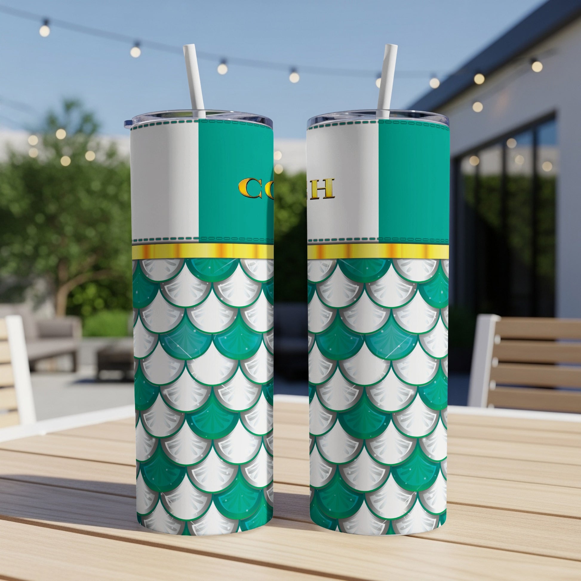 Two tumblers with white, green, and gold scales and "CO H" text.