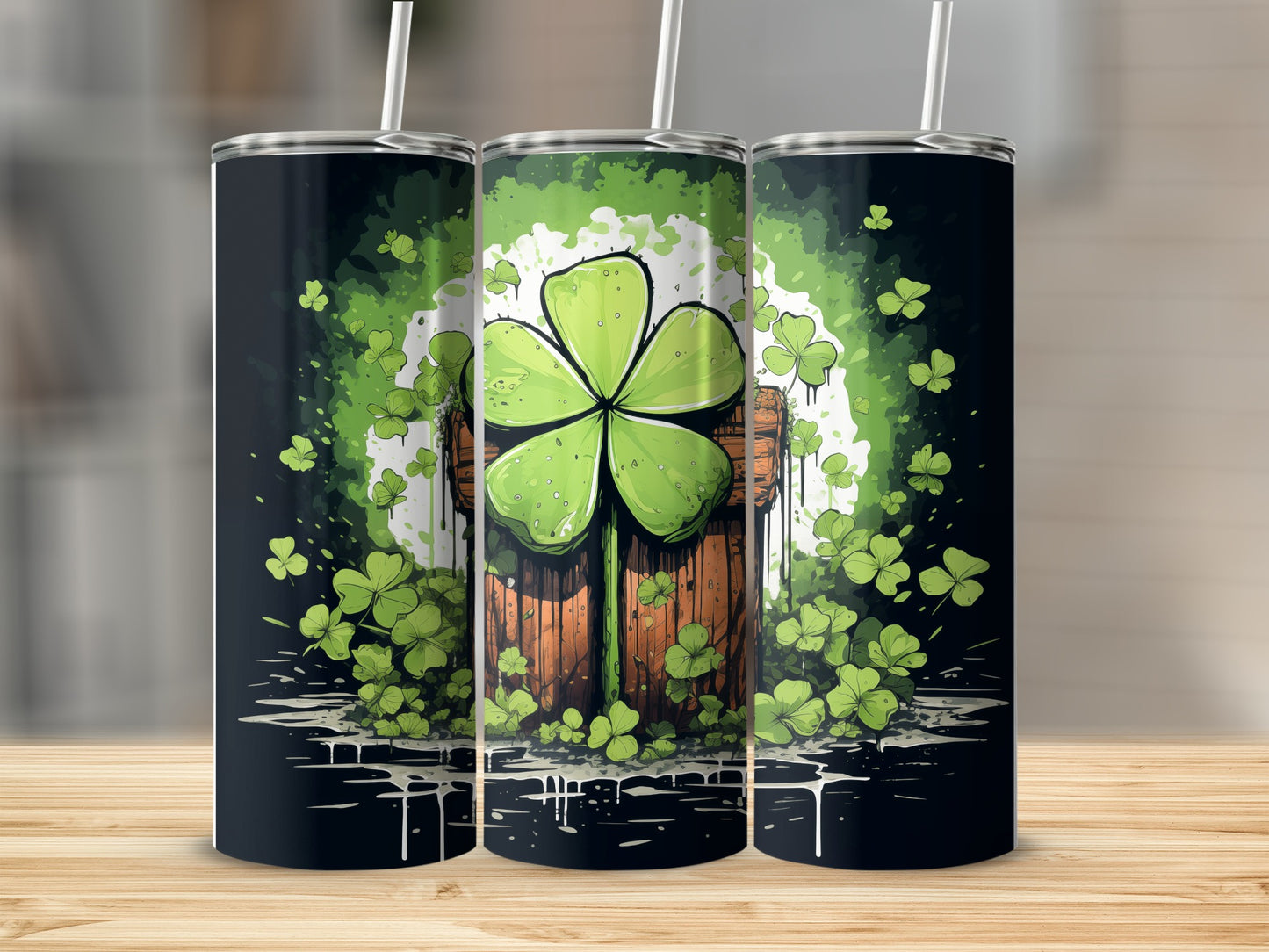 Three St. Patrick's Day tumblers with shamrocks and a wooden bucket design.