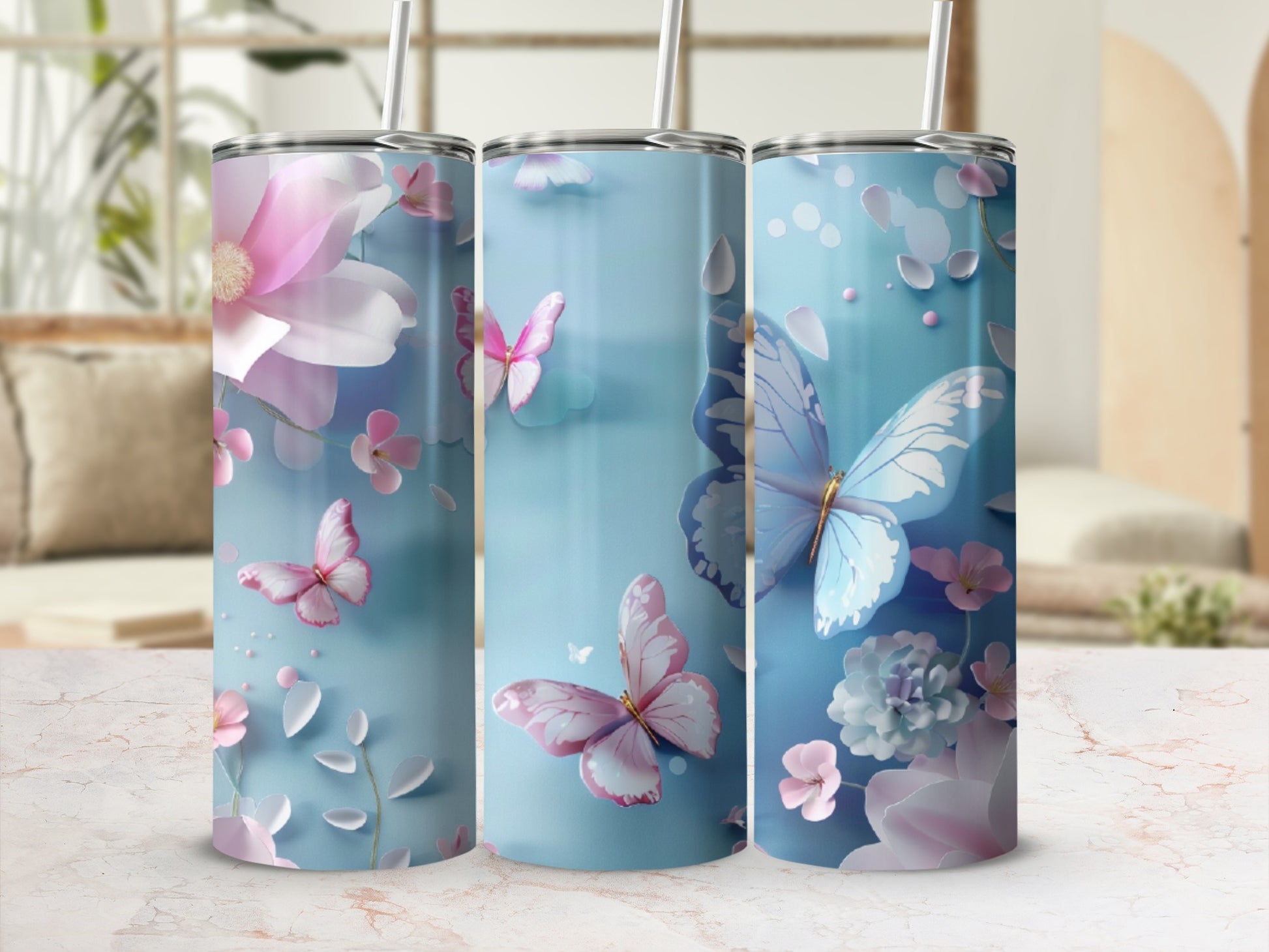 Blue tumbler with pink butterflies and floral accents.