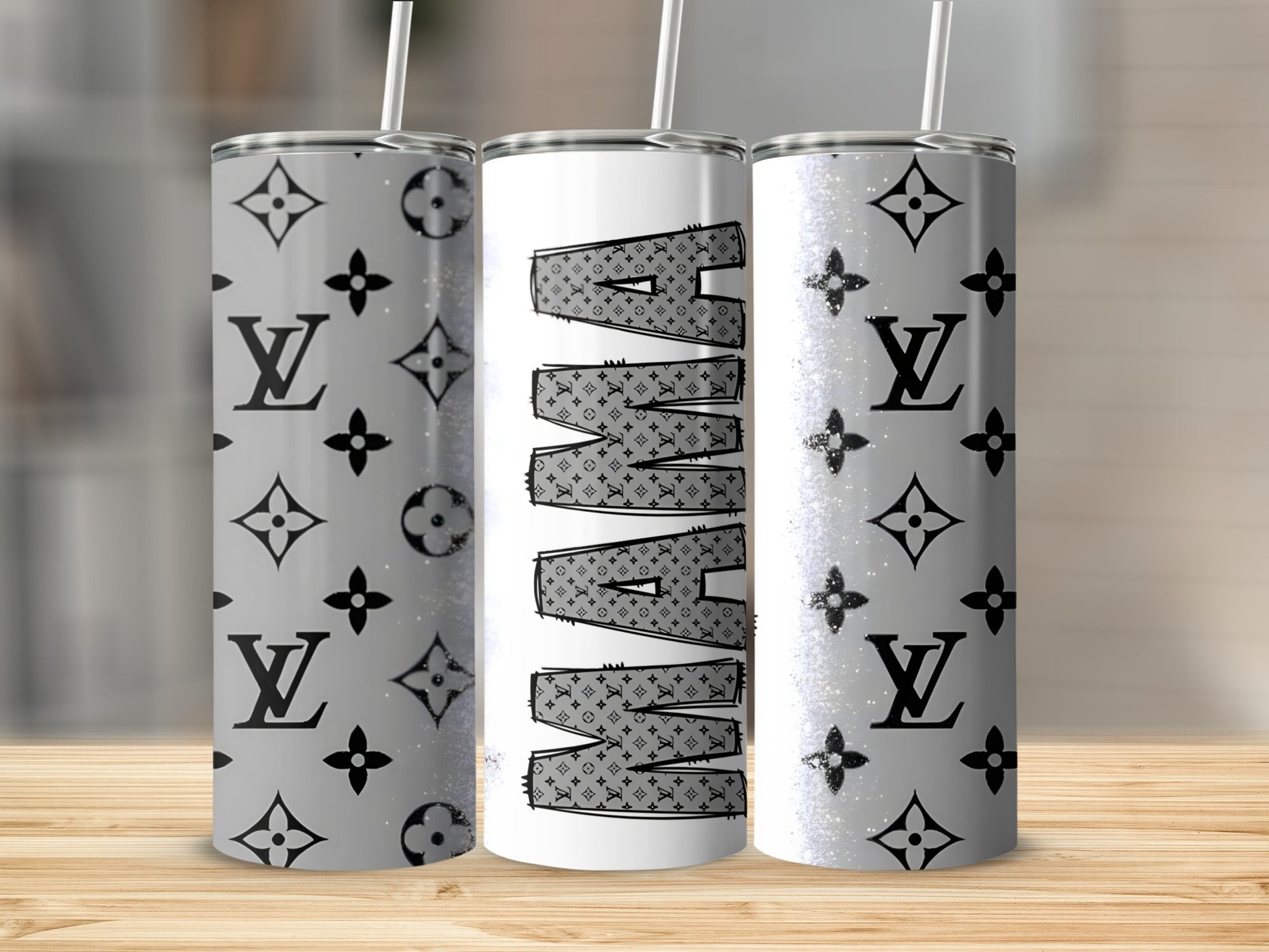 Three tumblers with "MAMA" in repeating LV monogram pattern and glitter.