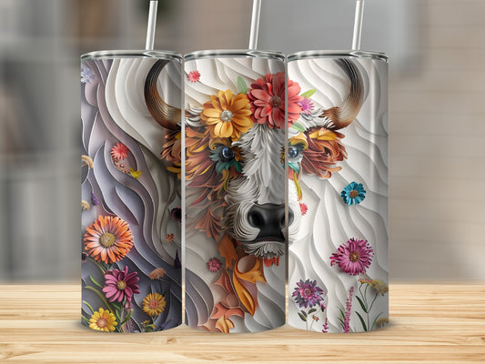 Three tumblers featuring a cow adorned with colorful floral embellishments.
