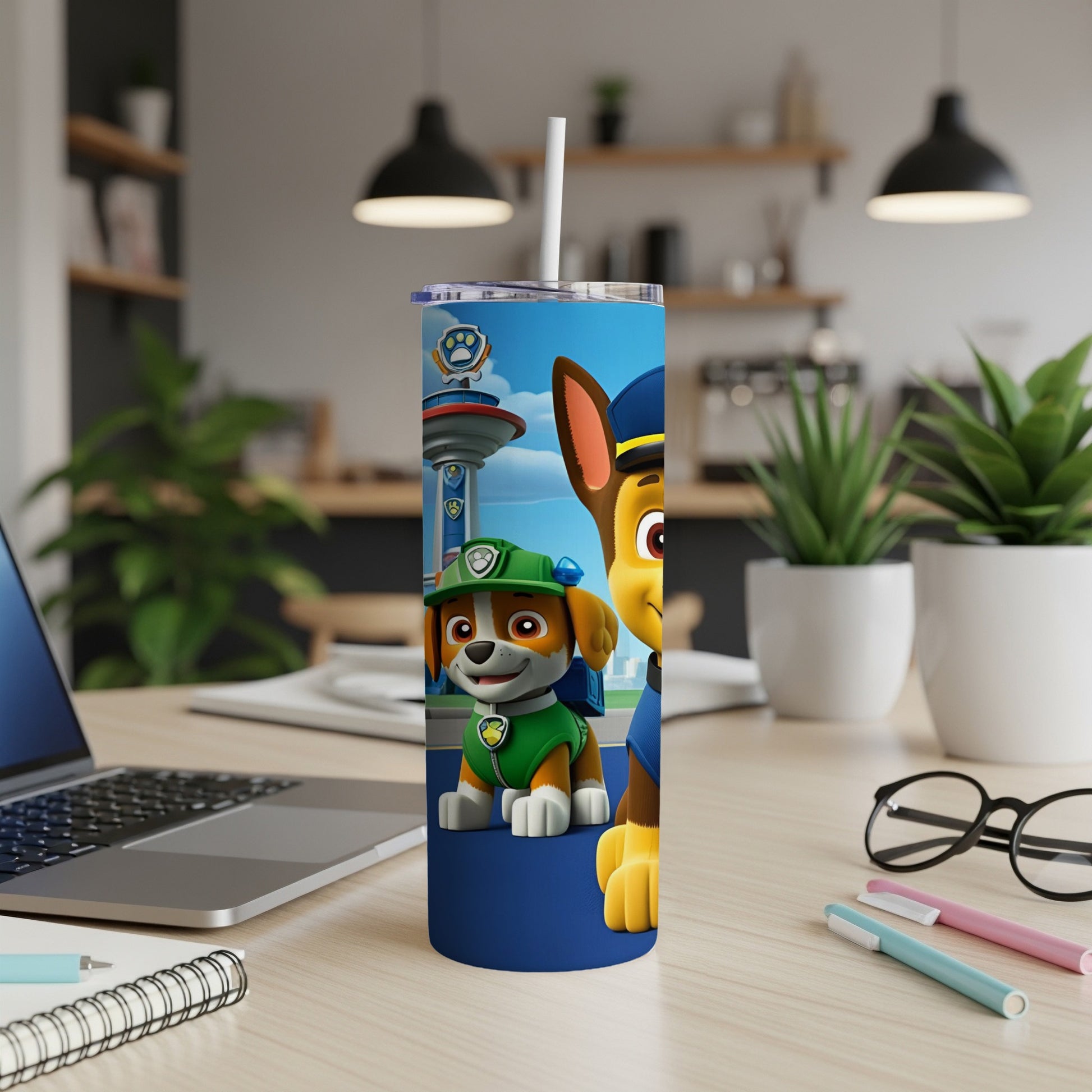 Paw Patrol Chase and Marshall characters on a blue insulated tumbler.