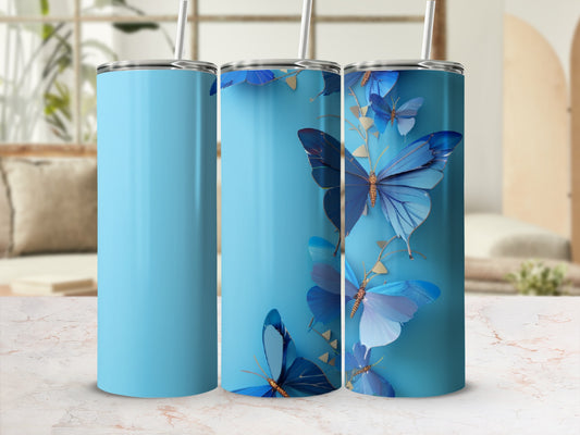 Blue tumbler with gold accents and realistic blue butterflies.