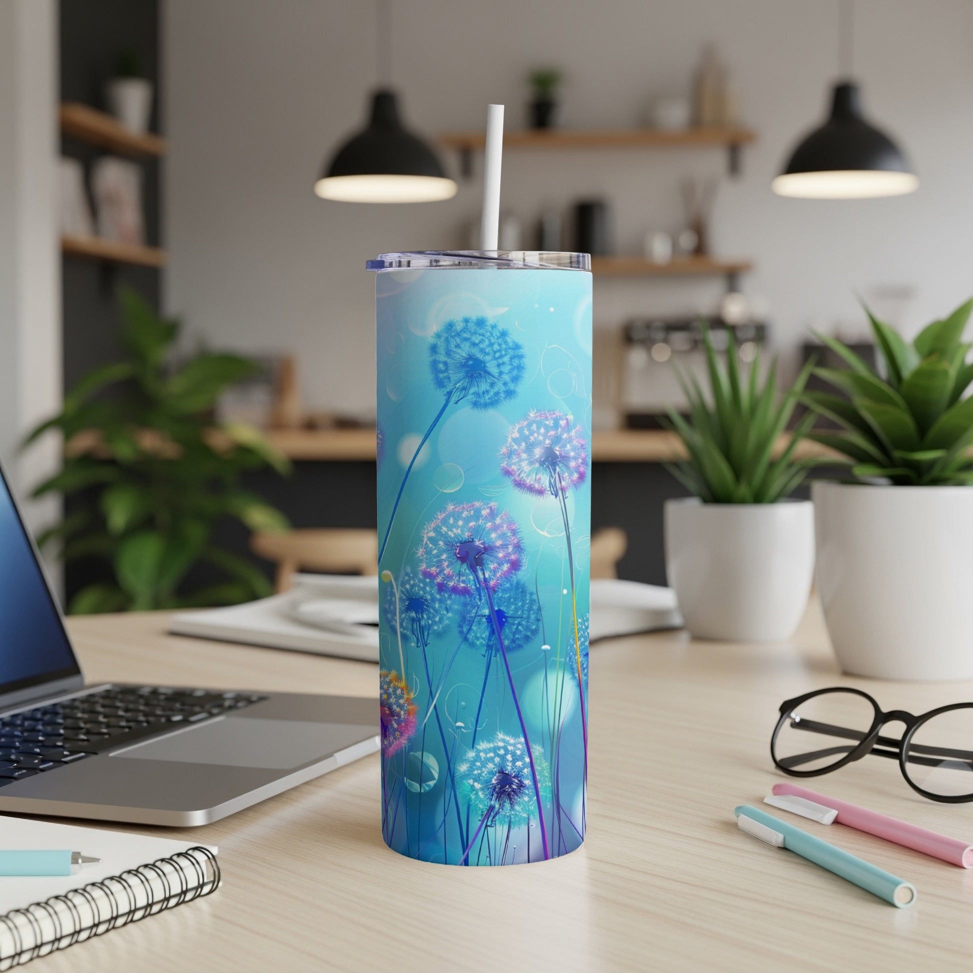 Tall tumbler with blue background and luminous dandelion illustrations.