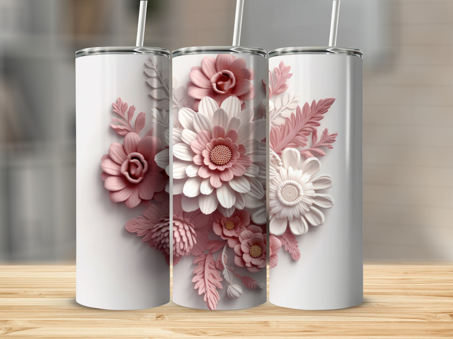 Three white tumblers with intricate pink and white floral designs.