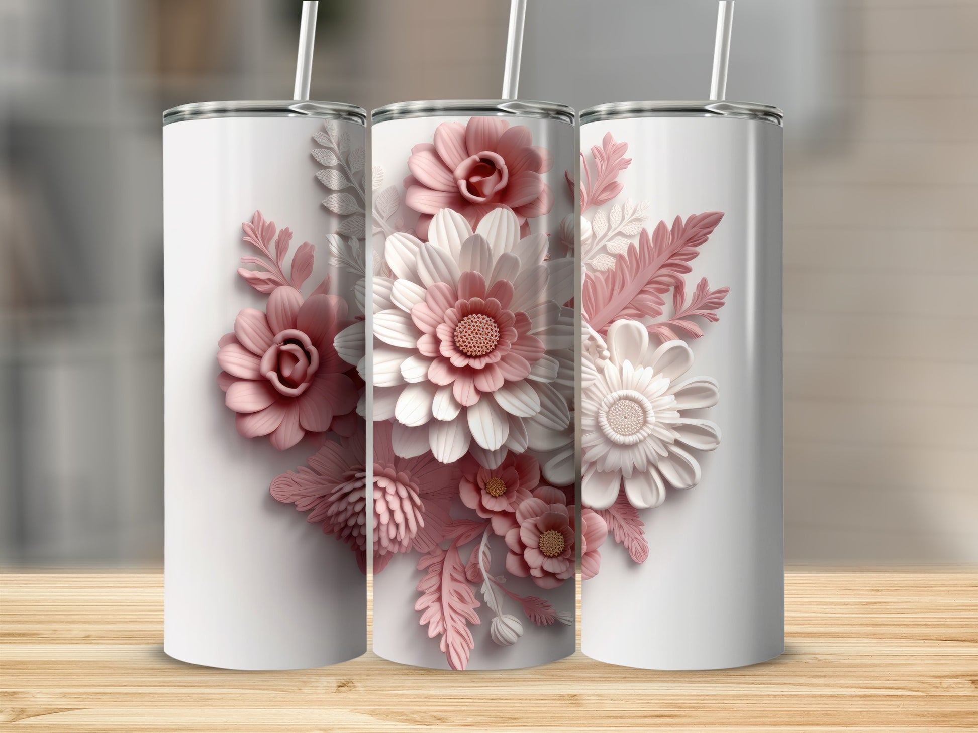 Three white tumblers with intricate pink and white floral designs.