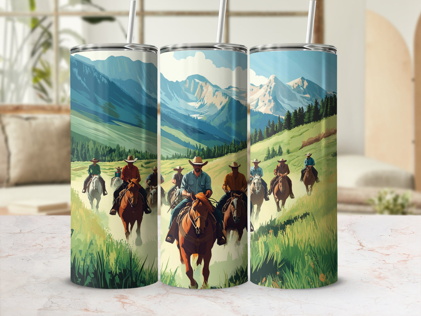 Three tumblers with a mountain landscape and cowboys riding horses.