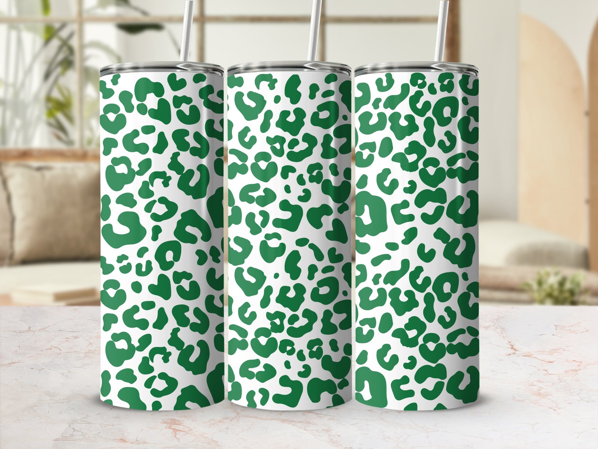 Green leopard print tumblers with white straws.