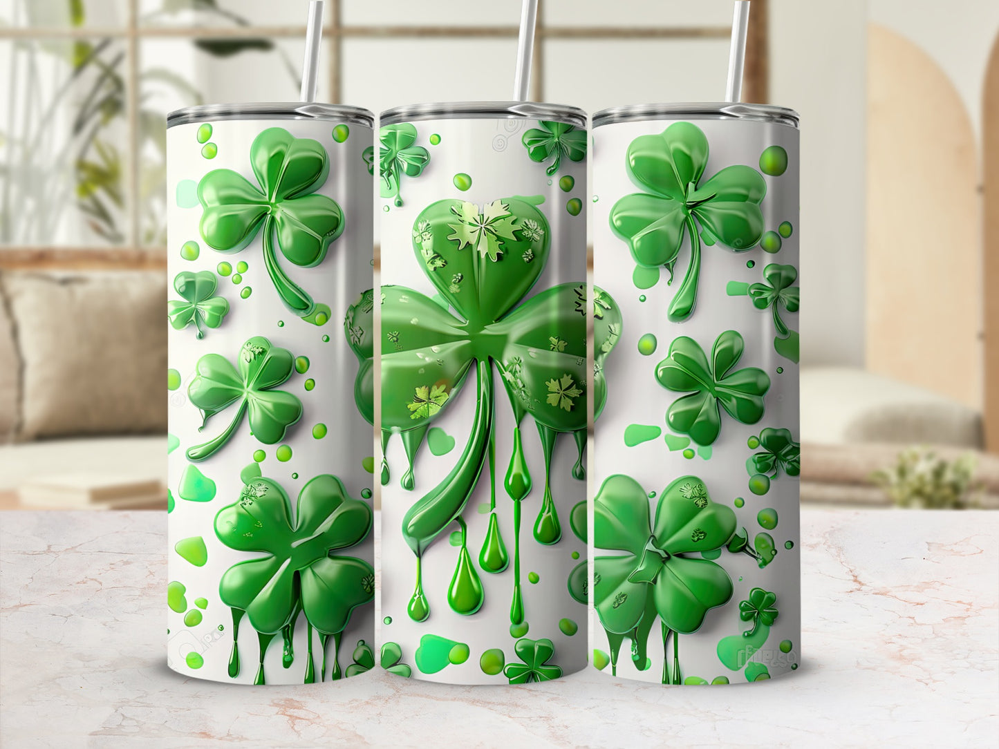 Three tumblers with dripping shamrock designs.