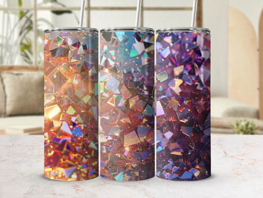 Three glittery tumblers with geometric crystal patterns in warm and cool tones.