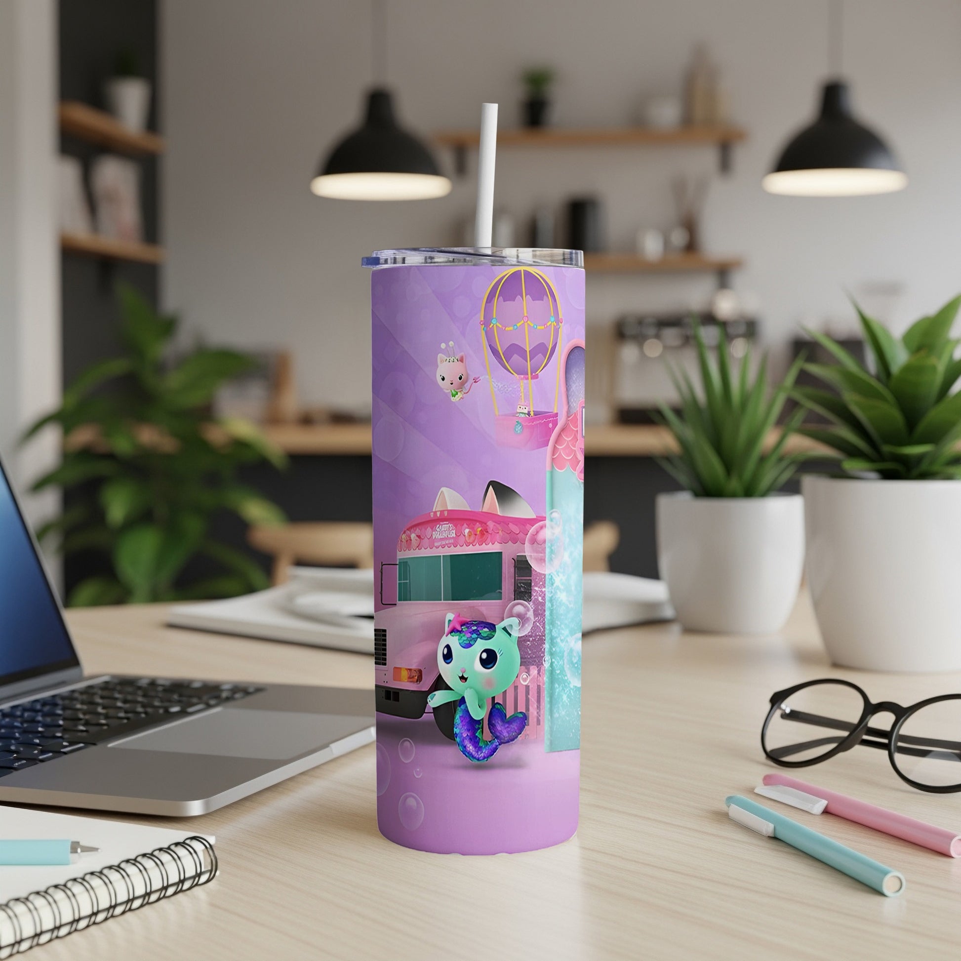 Purple tumbler with cartoon mermaid character and a pink ice cream truck.