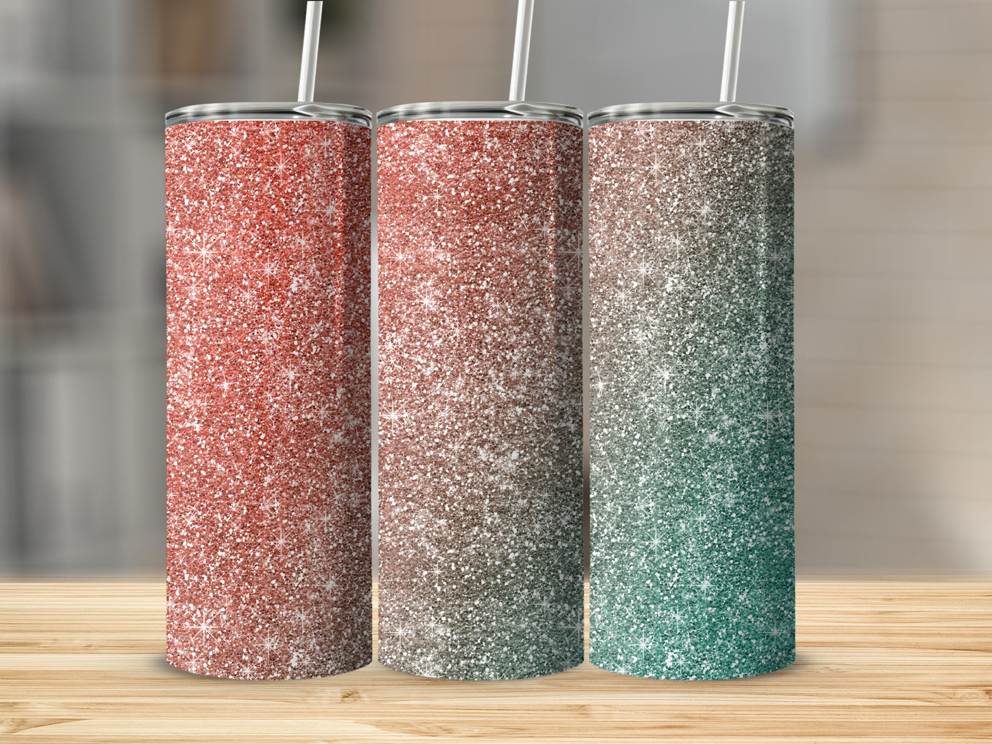 Three glitter tumblers with straws in red, brown, and green ombre.