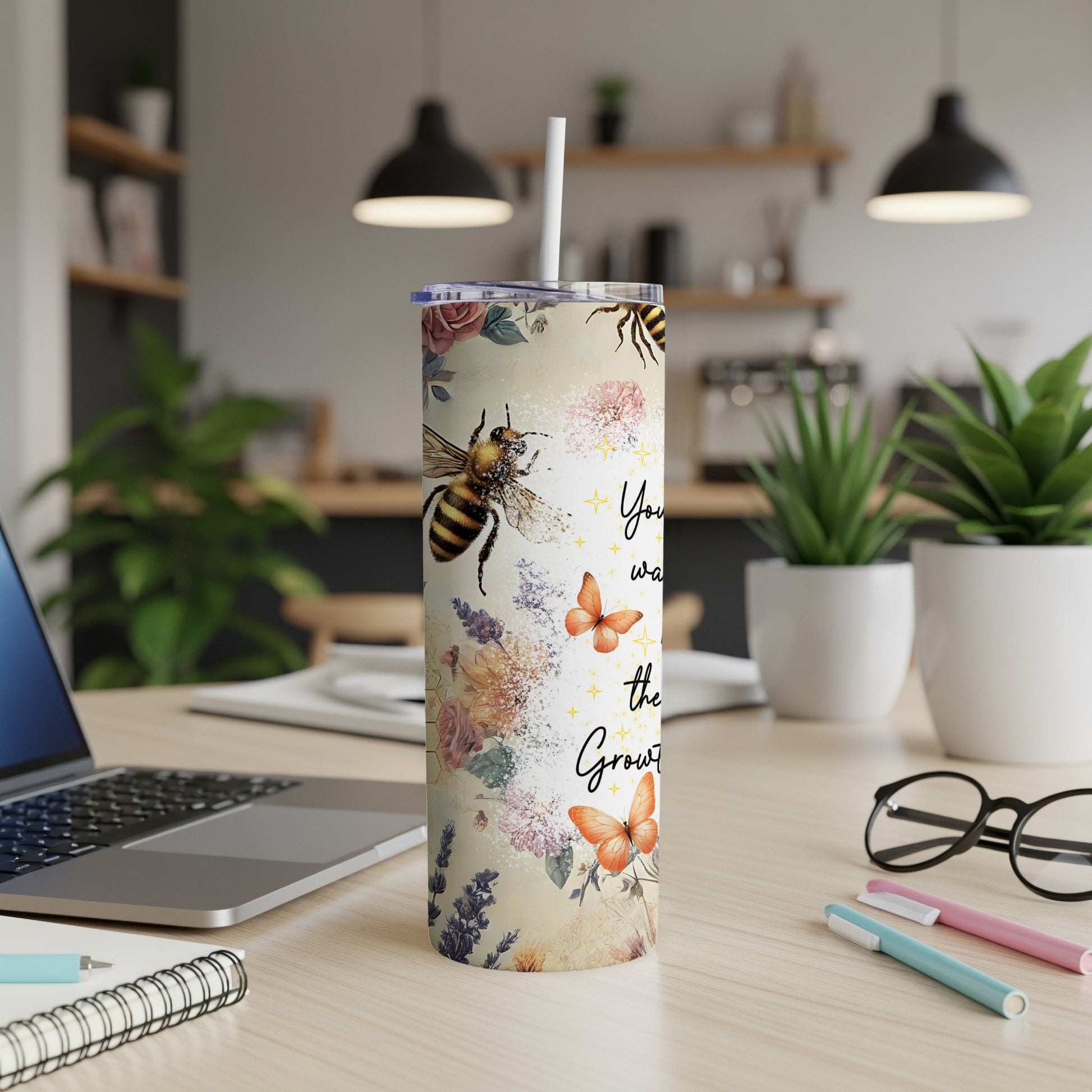 Tall tumbler with floral and bee design, featuring text "You were meant to Grow."