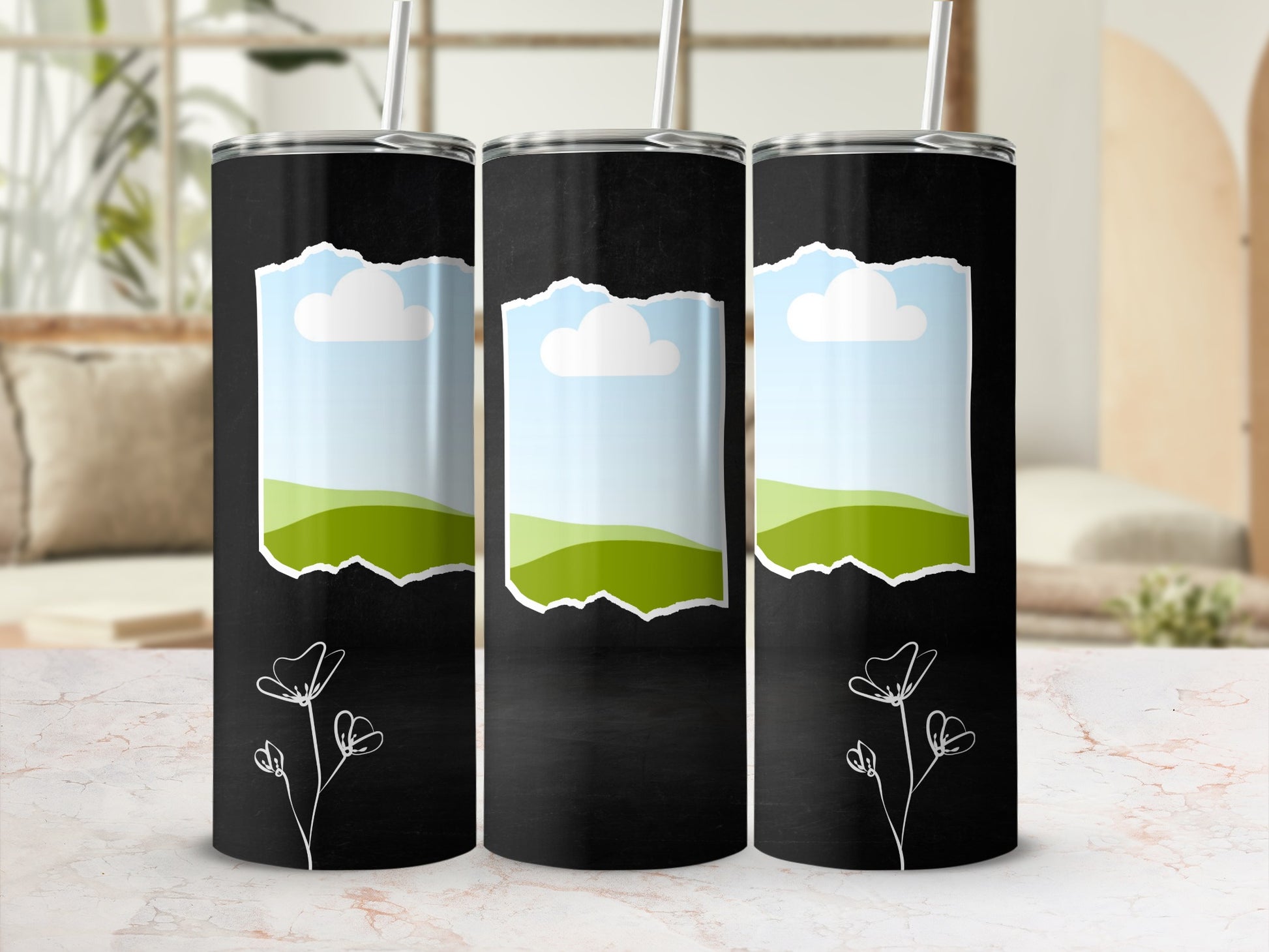 Three black tumblers with sky, cloud, and hill designs and floral accents.