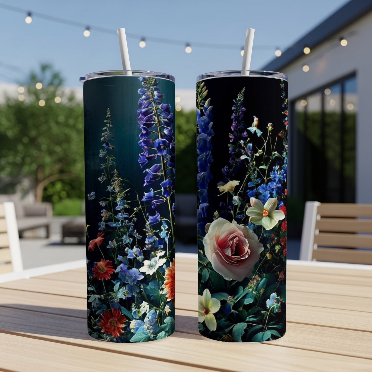 Two tumblers with a dark floral design featuring roses and blue delphiniums.