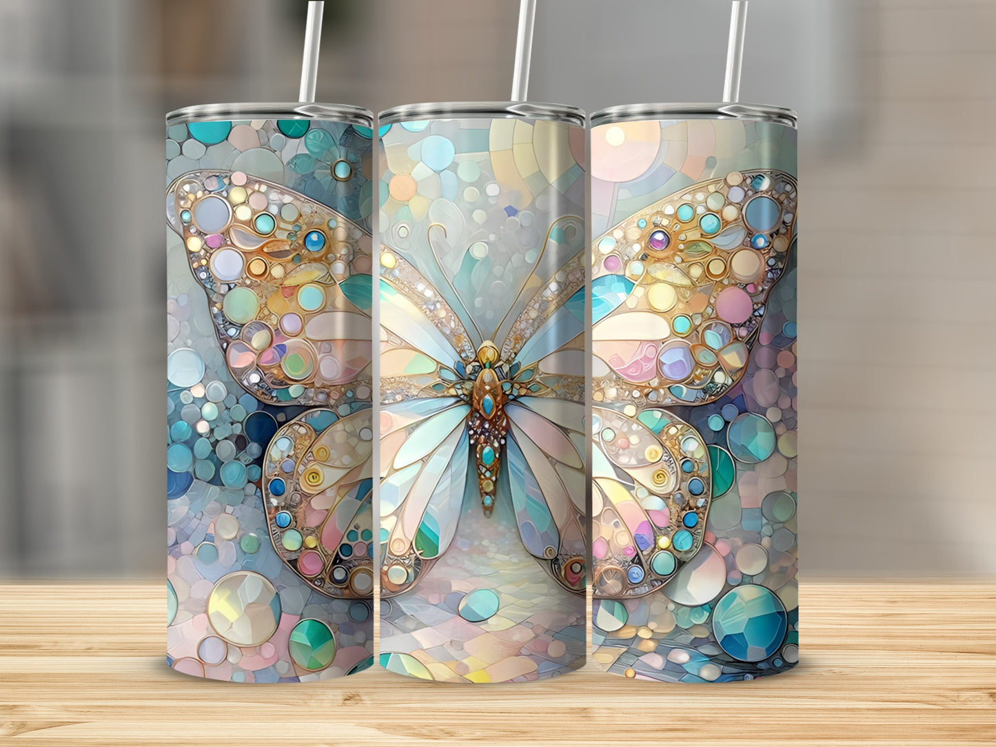 Three tumblers with iridescent butterfly and mosaic designs.