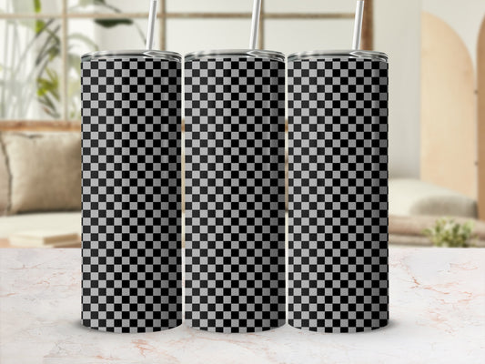 Three tumblers with black and white checkered pattern on a marble surface.