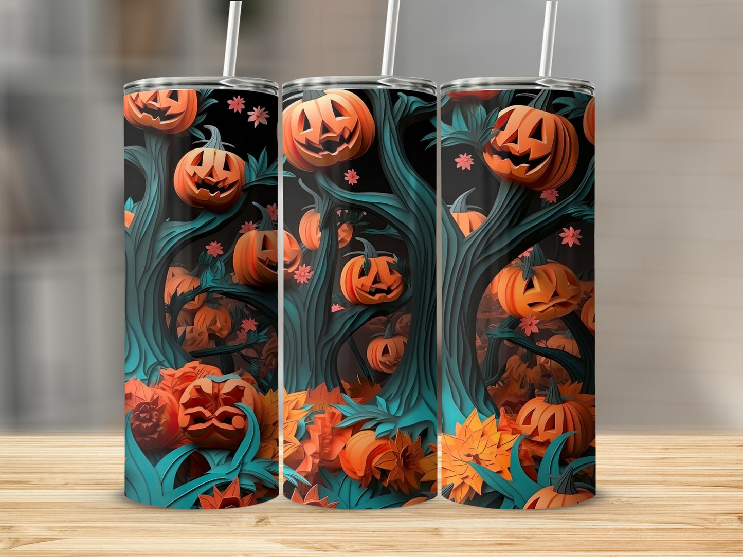 Three tumblers with a Halloween forest design featuring jack-o'-lanterns and autumn leaves.