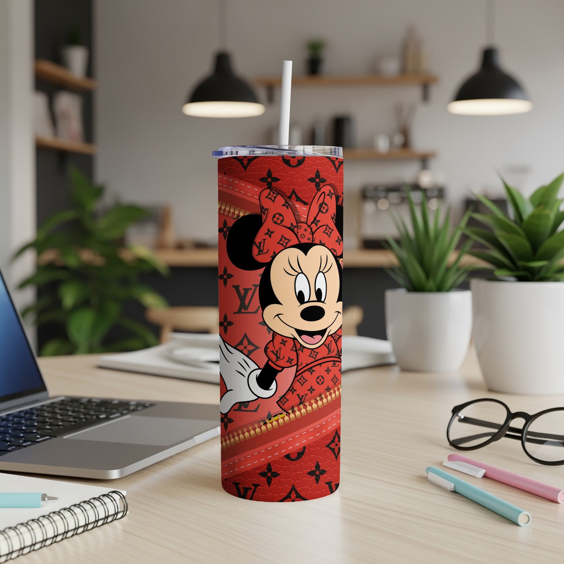 Minnie Mouse tumbler with red designer pattern and white straw.