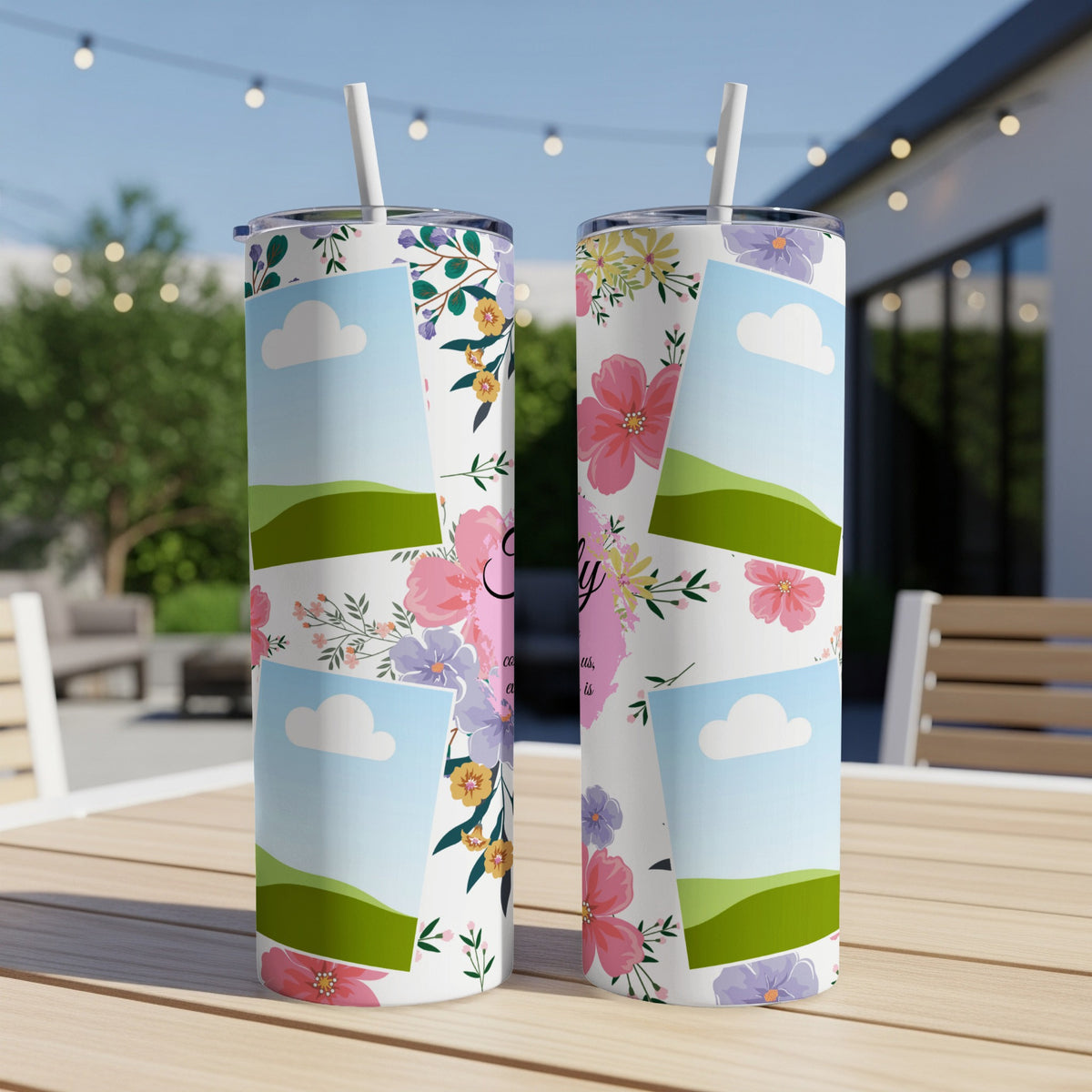 Two tumblers with floral designs, clouds, and hills.