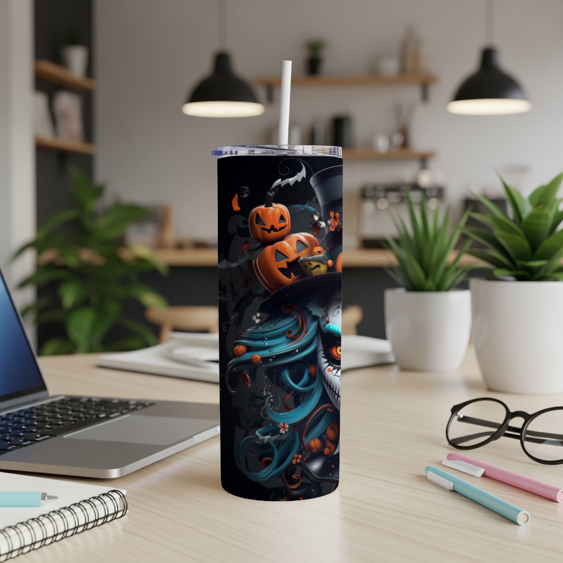 Halloween tumbler with pumpkins, bats, and a skull-like figure.