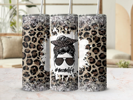 Tumbler with leopard print, glitter, sunglasses, and "#momlife" text.