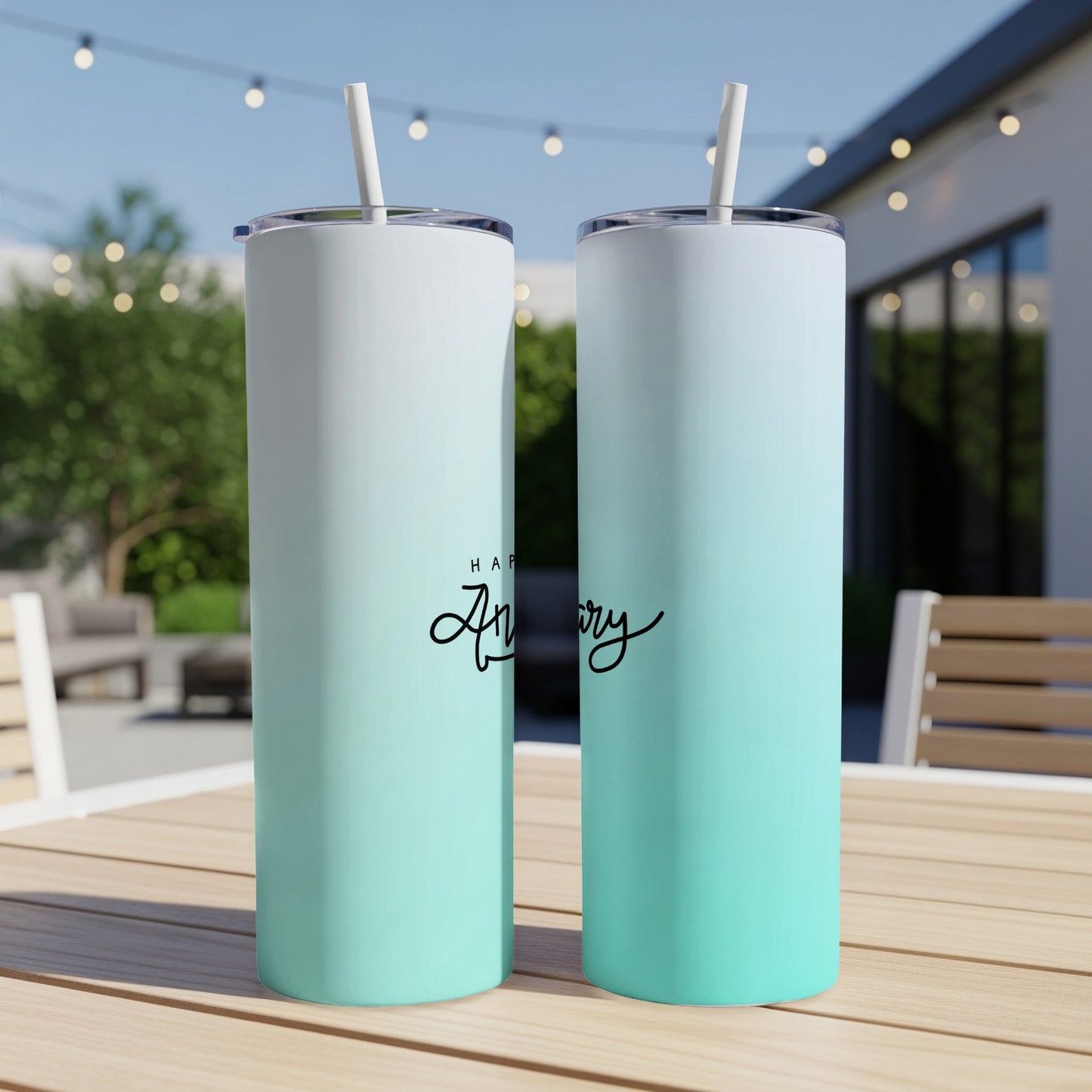 Two tumblers with ombre teal and white designs, saying "Happy Anniversary".