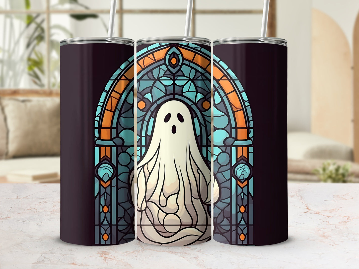 Stained glass ghost tumbler with straw, set against a light marble countertop.