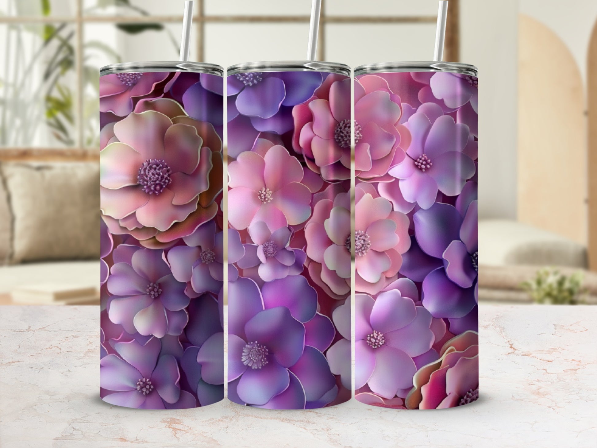 Three tumblers with a floral pattern of pink and purple flowers.