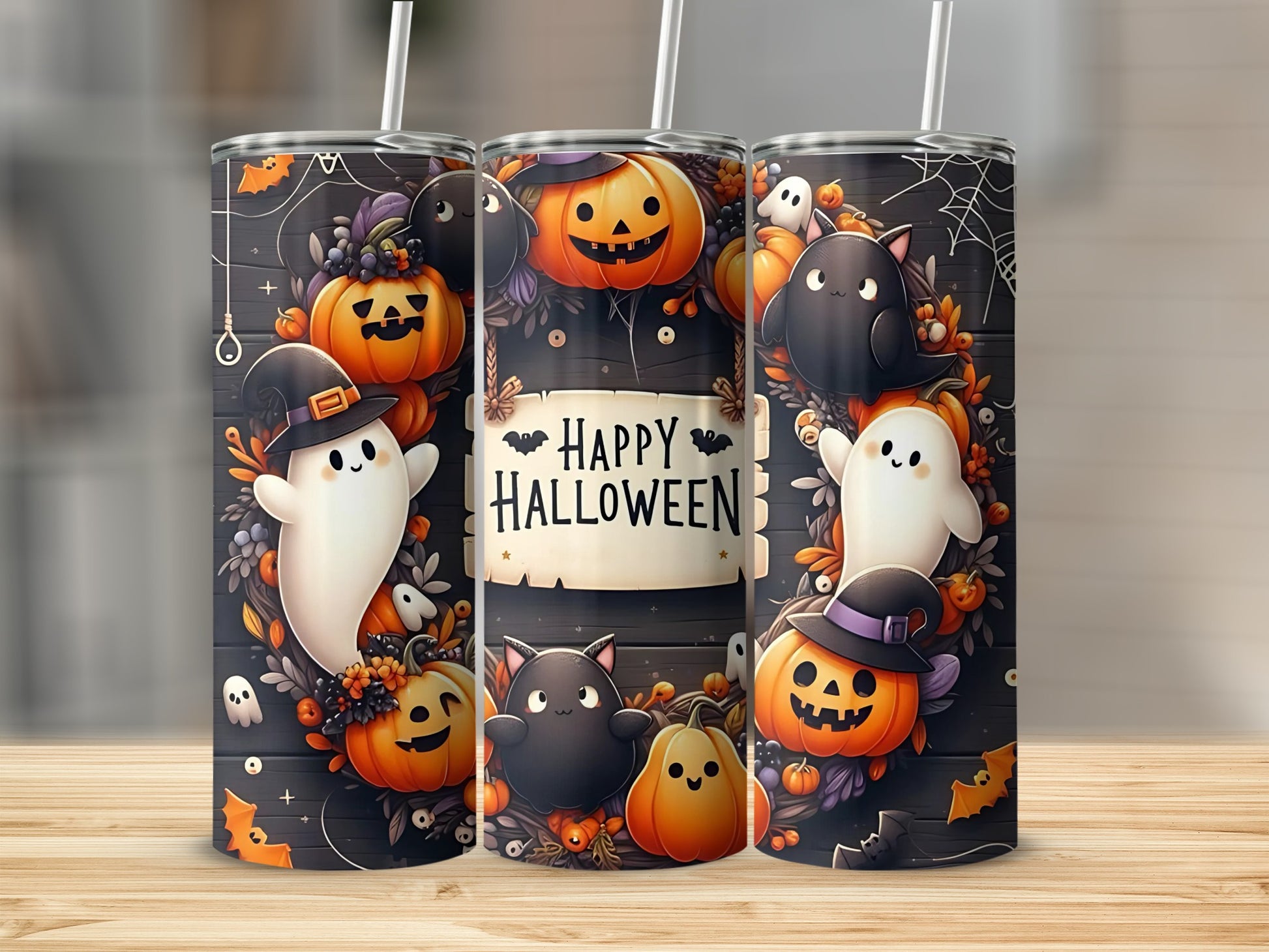 Three Halloween-themed tumblers featuring ghosts, pumpkins, and cats.
