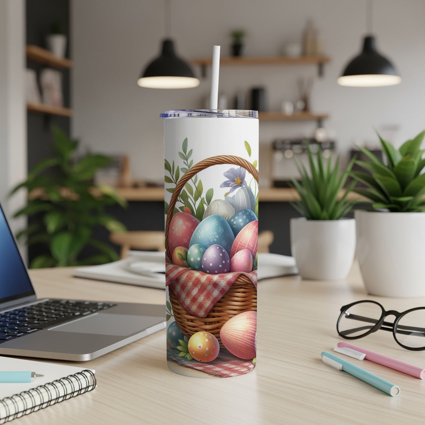 Easter basket with colorful eggs and straw on a wooden desk.