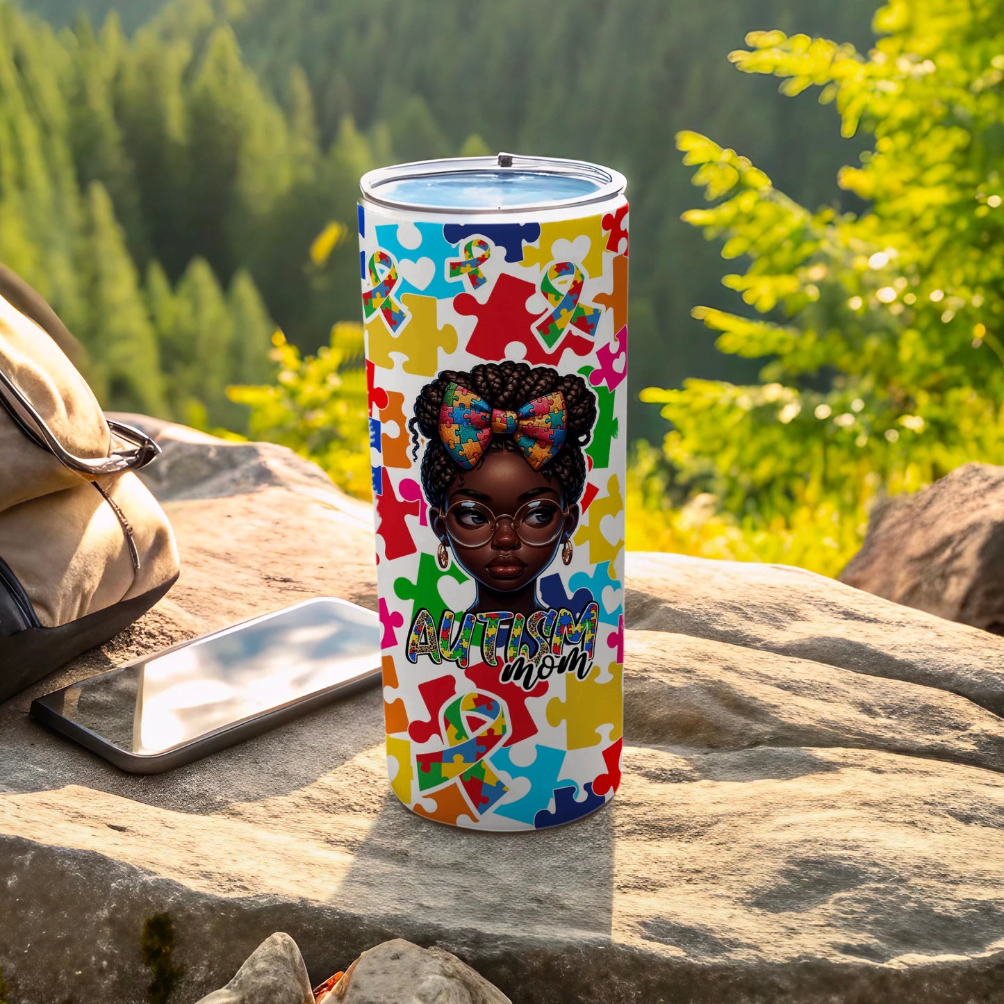 Autism mom tumbler with puzzle piece pattern and a girl wearing glasses.