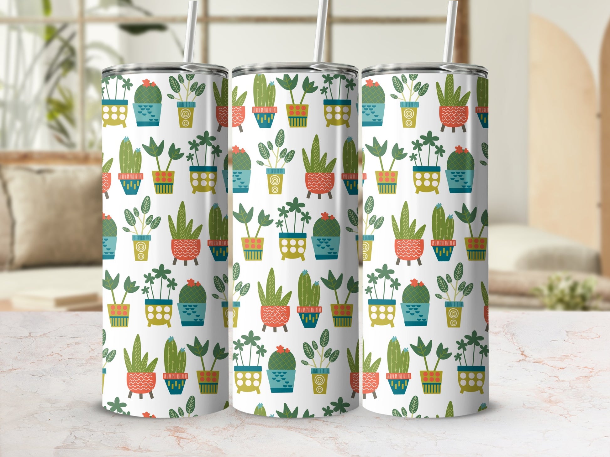 Three tumblers with a repeating pattern of potted cacti and plants.