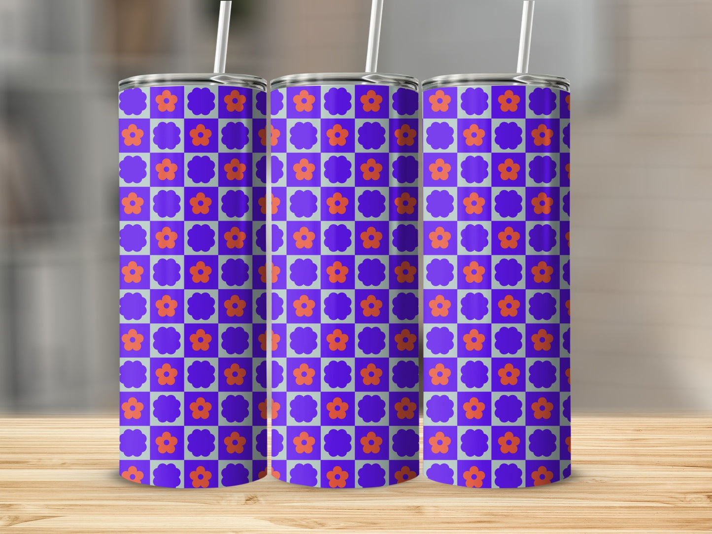 Three tumblers with a purple checkered background and orange floral pattern.