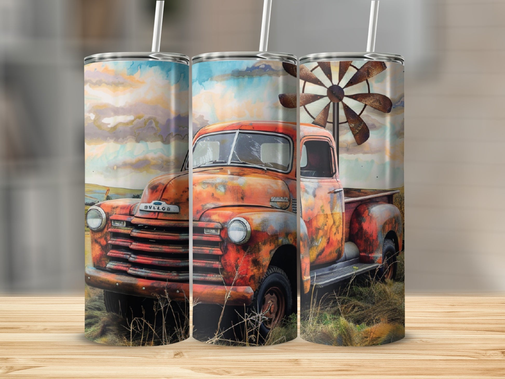 Rustic red truck with windmill and cloudy sky on a tumbler.