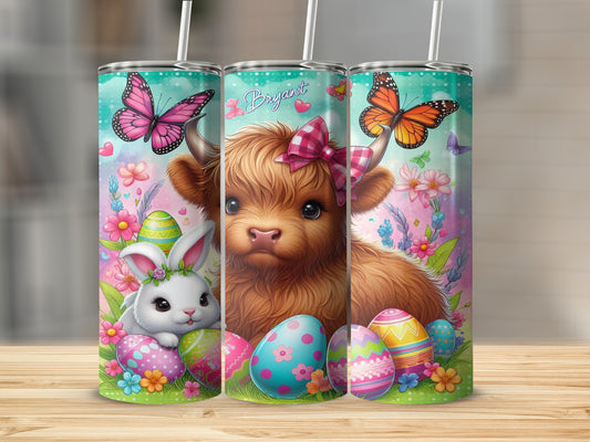 Highland cow and Easter bunny with colorful eggs and butterflies.