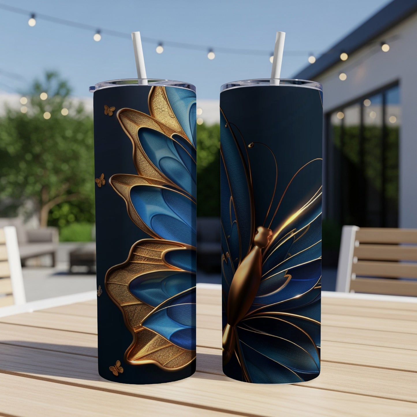 Two tall, dark tumblers with a blue and gold butterfly design.