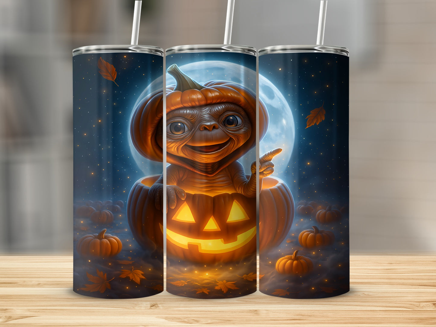Alien character dressed as E.T. in a jack-o'-lantern with moon and pumpkins.