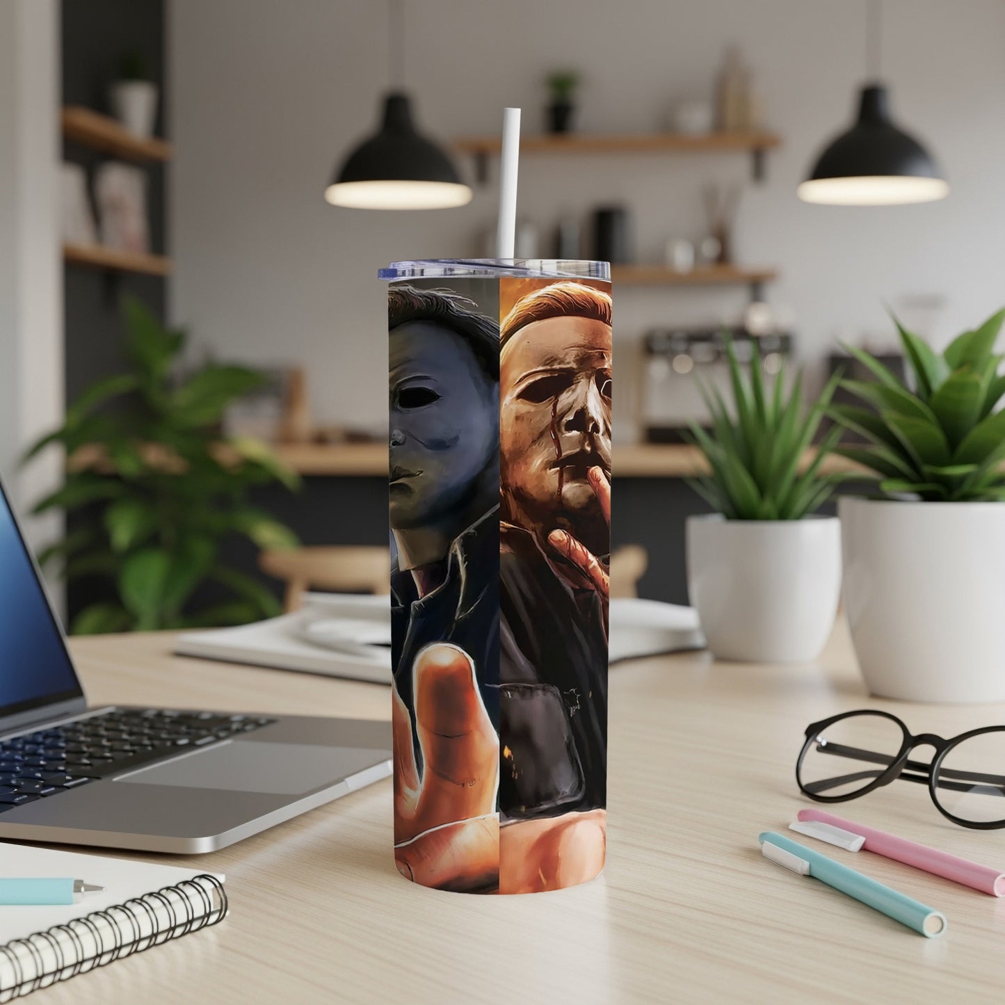 Tall tumbler with split design of Michael Myers' mask and bloody face.