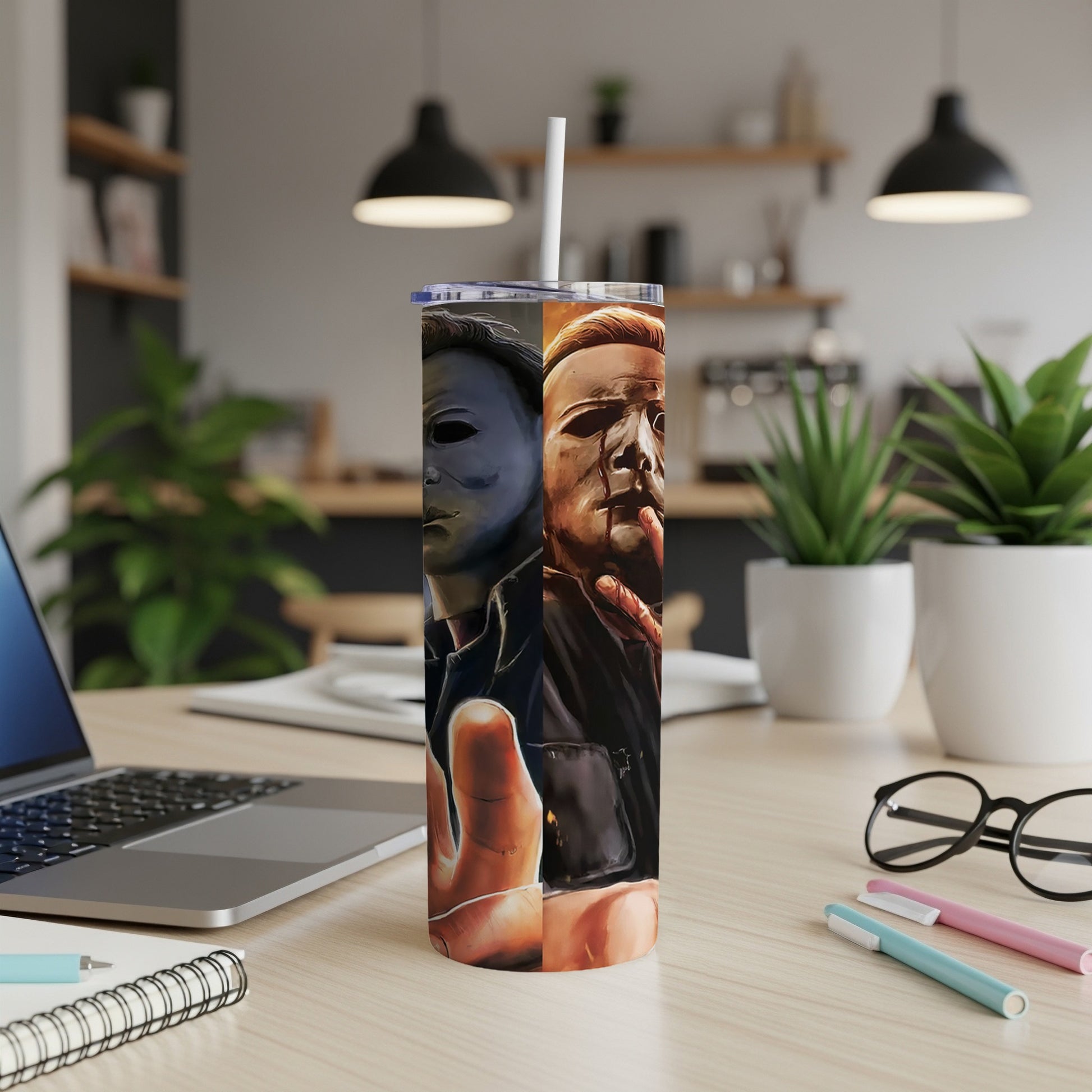 Tall tumbler with split design of Michael Myers' mask and bloody face.