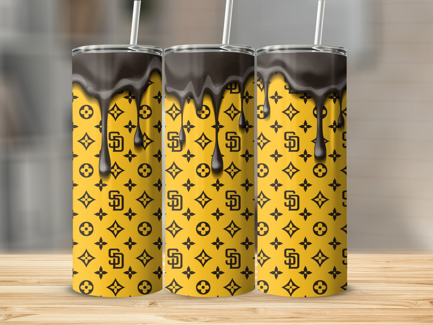 Brown Drips Above Patterns On Gold Background Tumblers