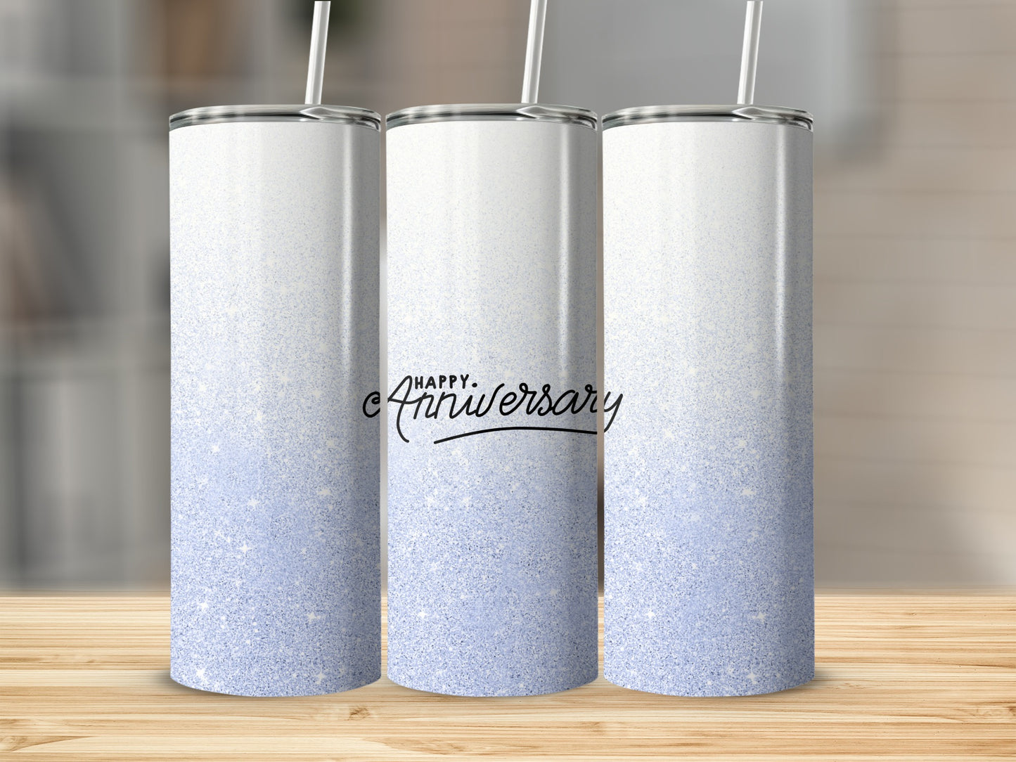 Three white tumblers with a gradient of white to light blue glitter and "Happy Anniversary" text.