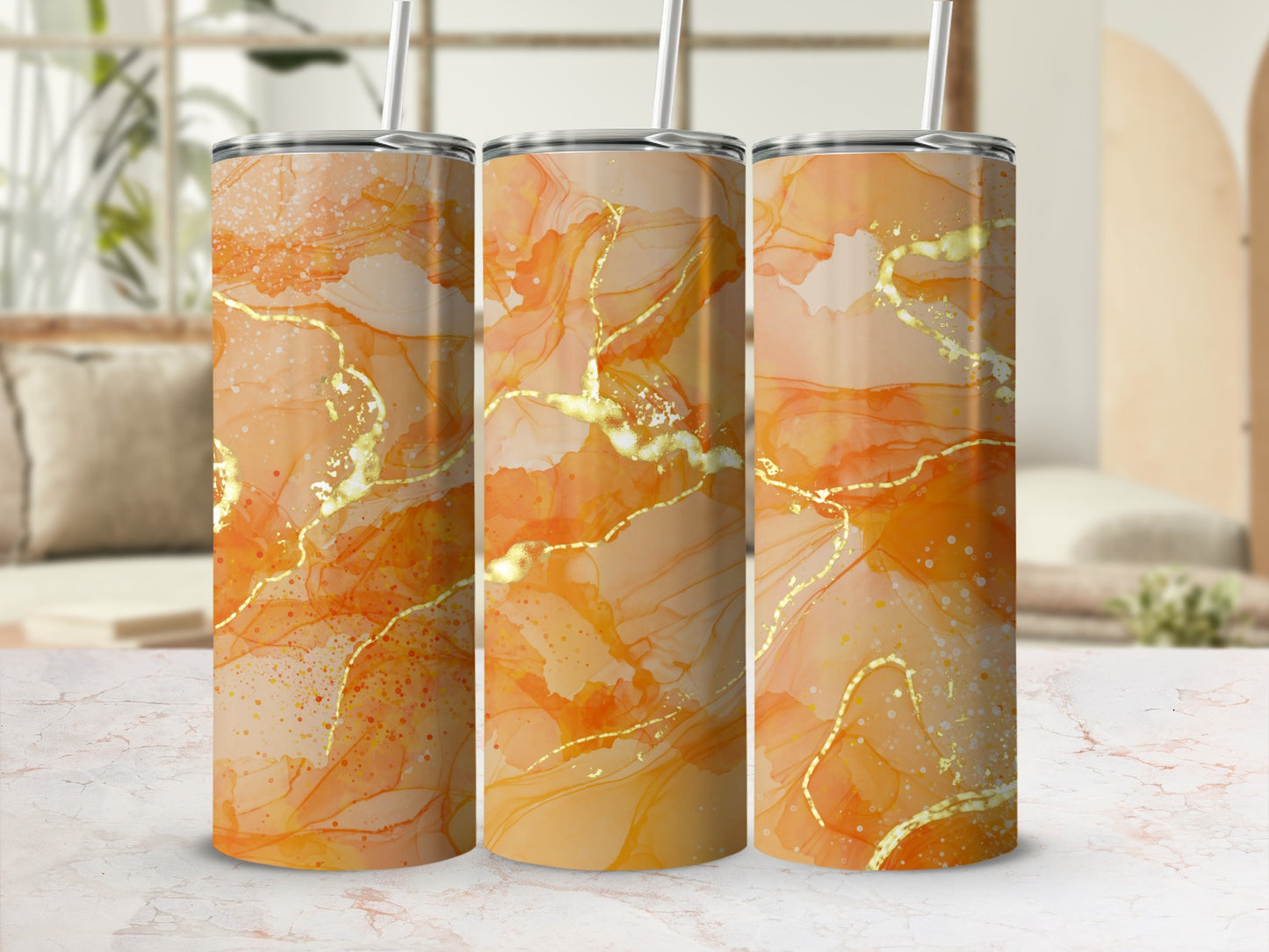 Three tumblers with an abstract orange and gold marble design.