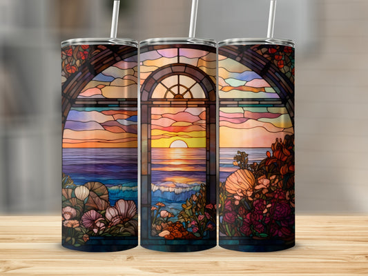 Stained glass tumbler with ocean sunset scene and floral accents.