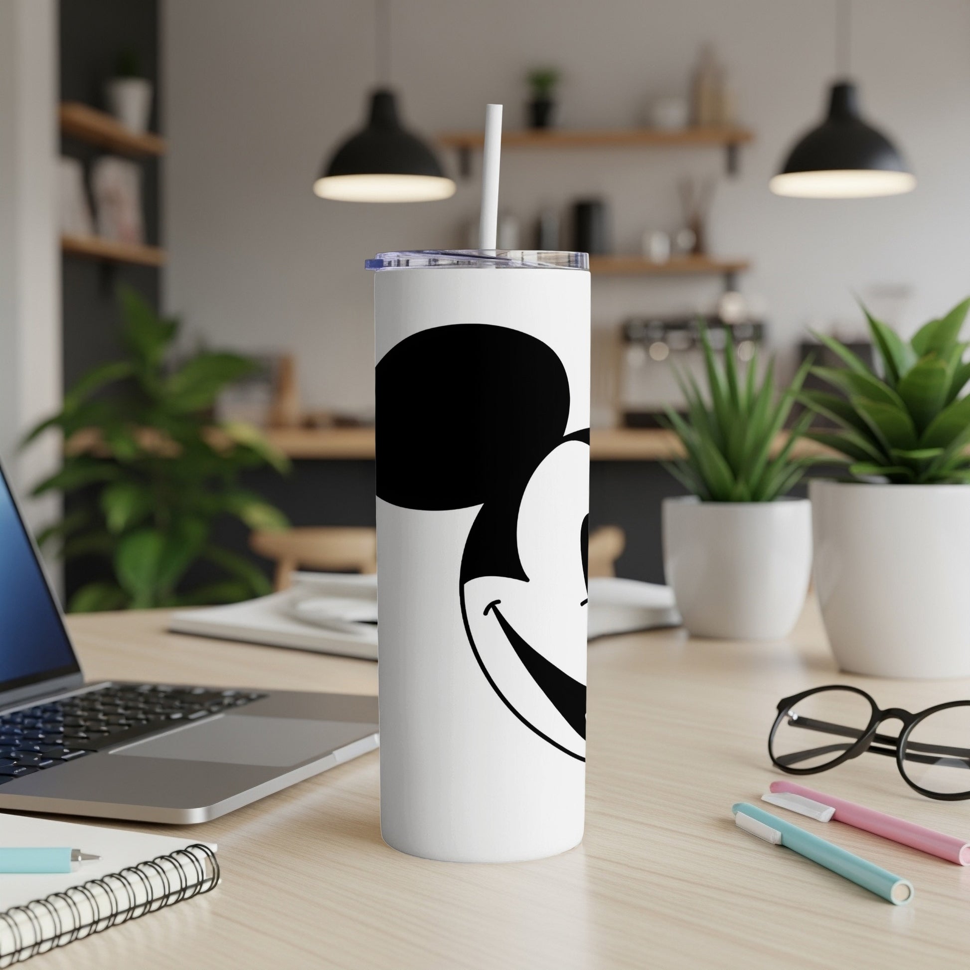 White tumbler with Mickey Mouse ears and face, lid and straw.