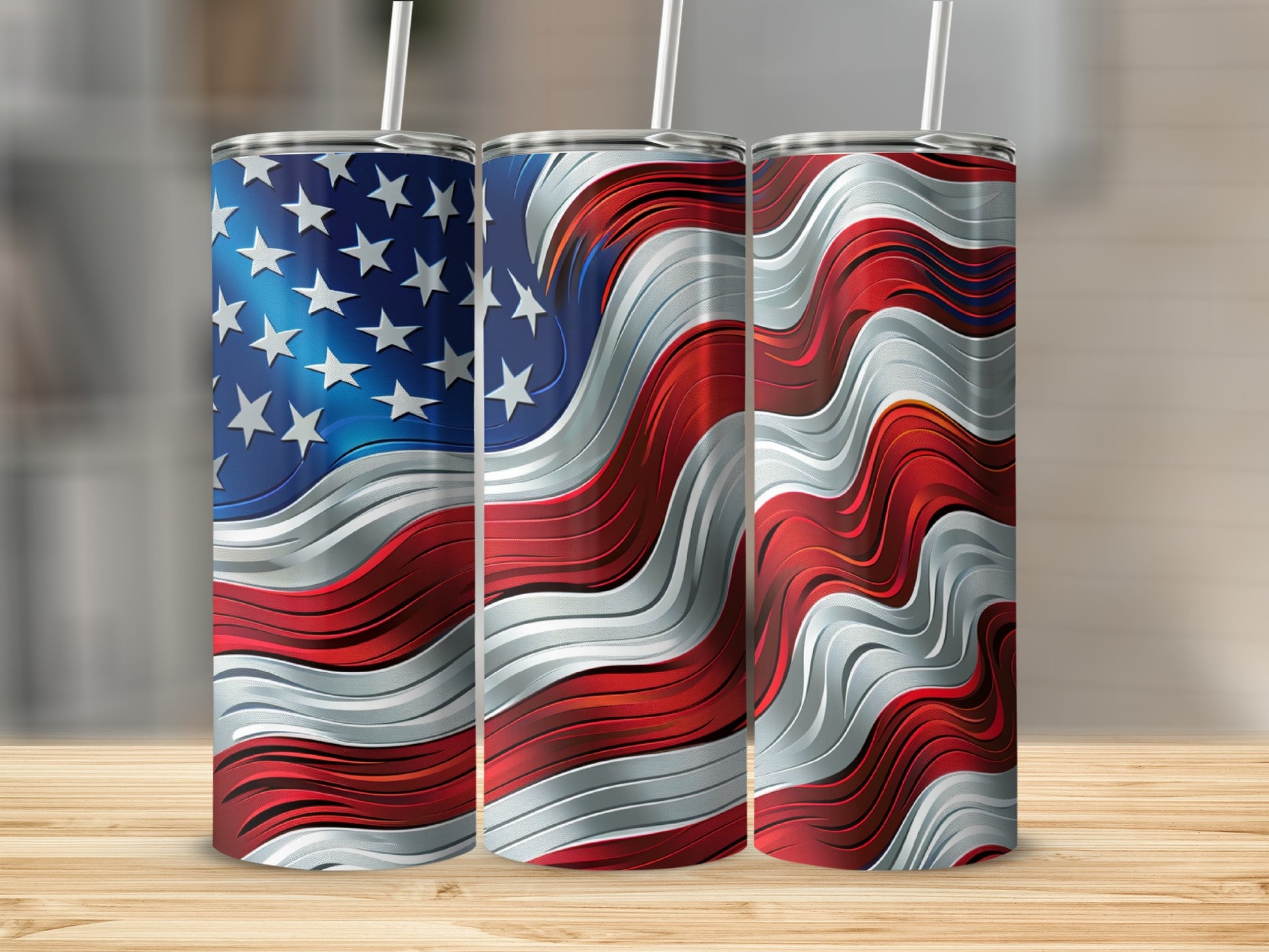 Three stainless steel tumblers with wavy American flag design.