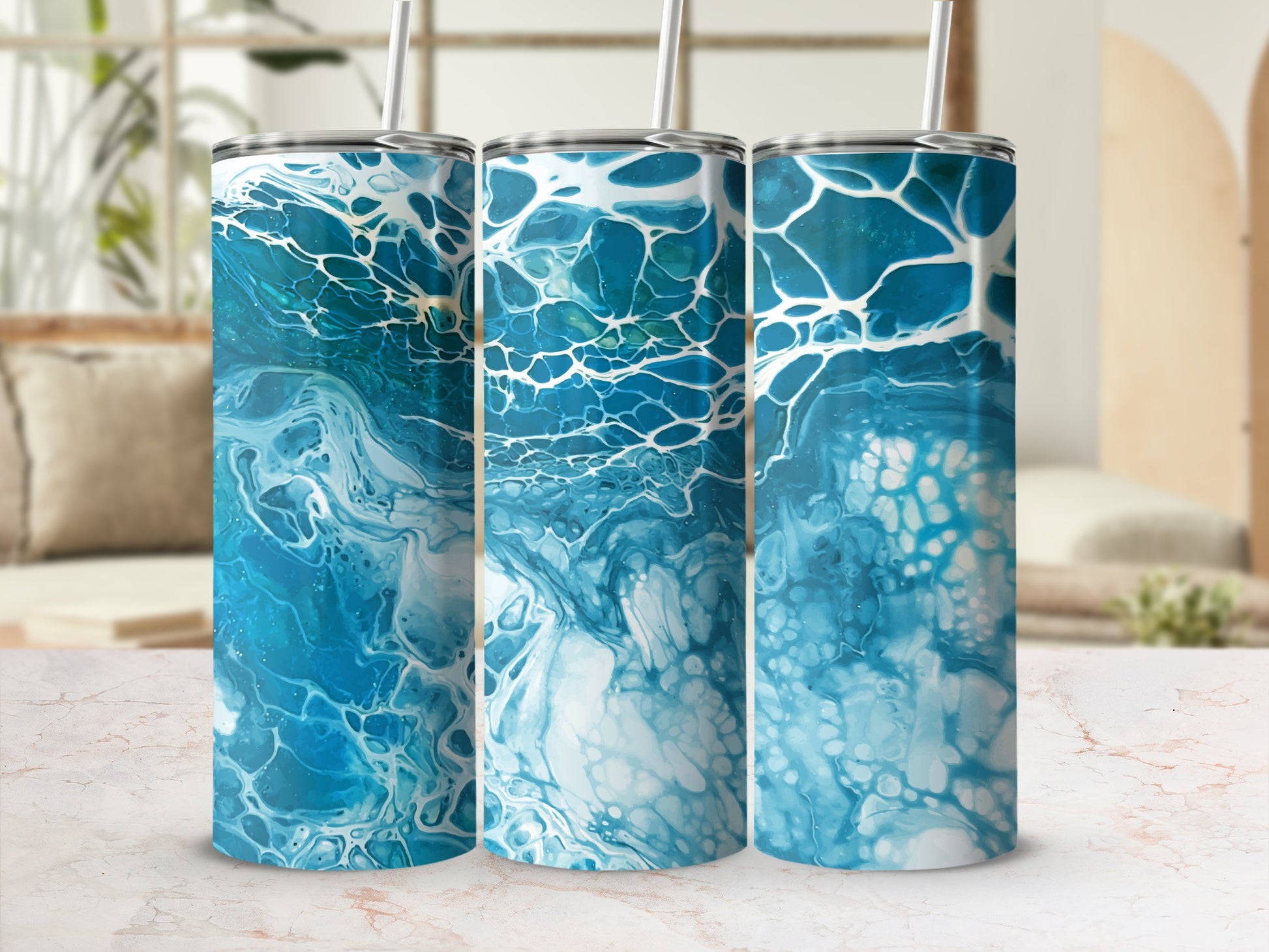 Three tumblers with abstract blue and white paint pour design