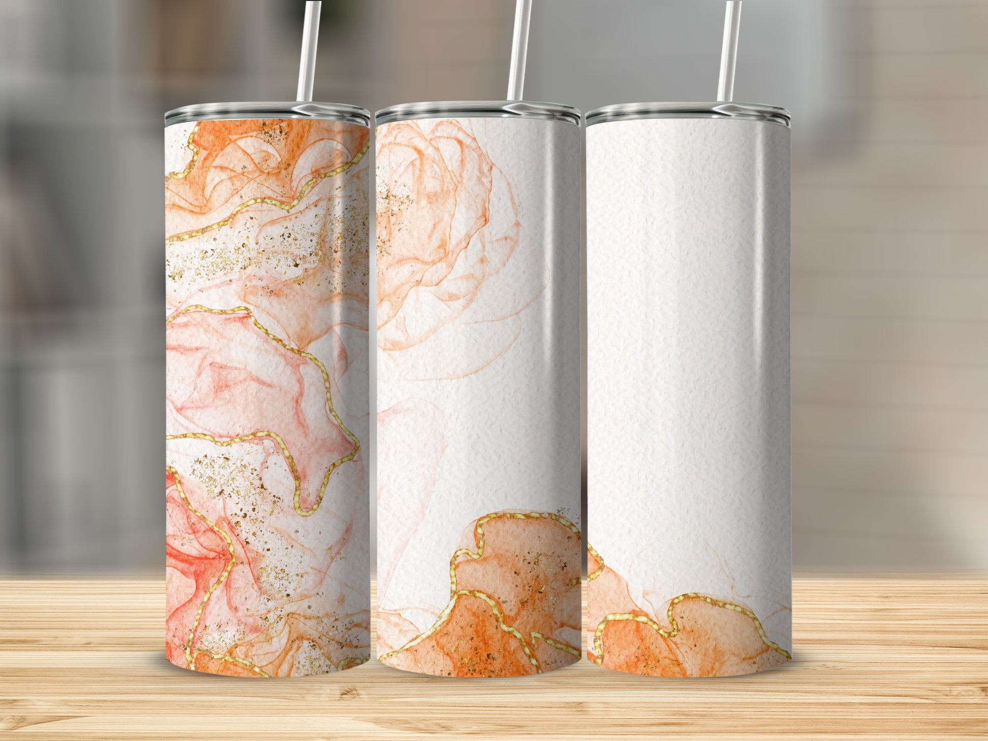 Three tumblers with abstract watercolor and gold glitter design.
