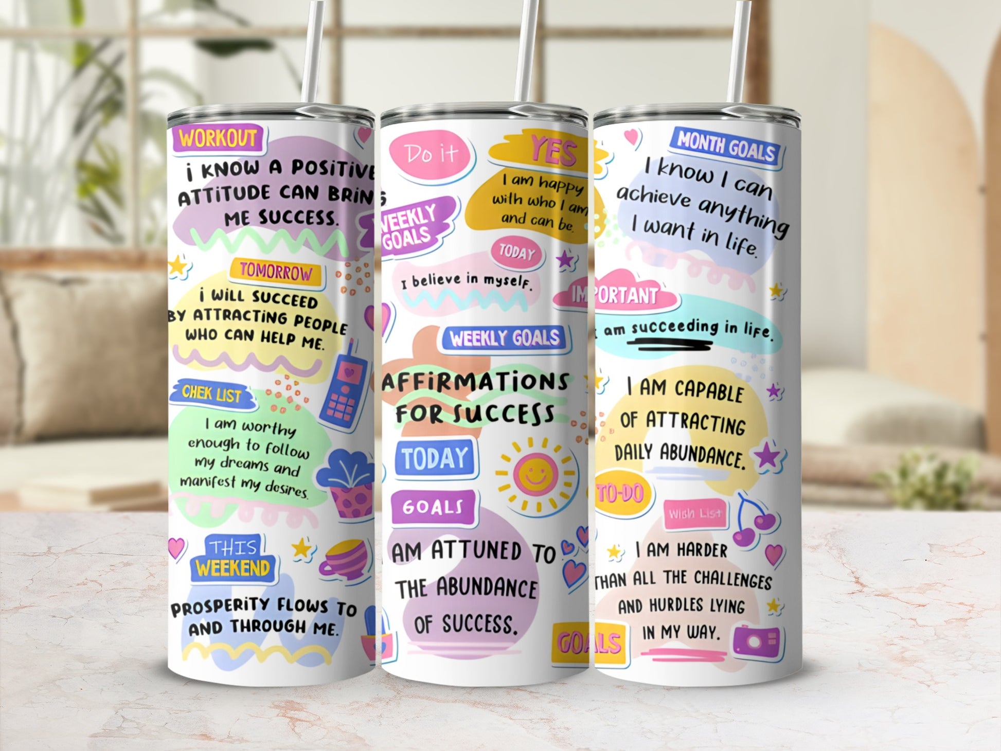 Three motivational tumblers with positive affirmations and colorful designs.